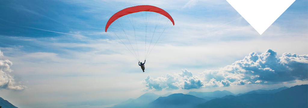 Hybrid IT services deliver many benefits including increased agility, elasticity, reliability, and innovation - image of parachute gliding safely.